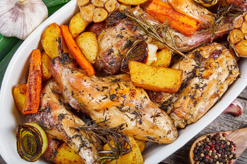Roasted rabbit with herbs and vegetables