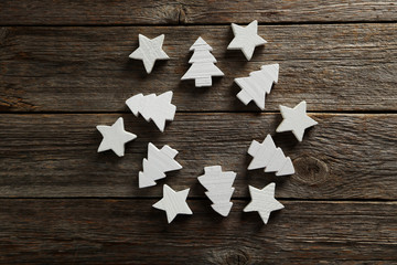 Decorative stars and fir-tree on a grey wooden background