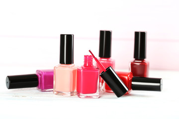 Bottles of nail polish on a wooden table