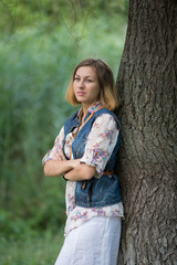 Young beautiful girl on a walk in the country