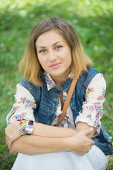 Young beautiful girl on a walk in the country