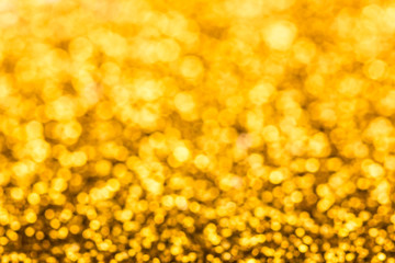 Golden defocused glitter background.