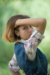 Obraz premium Young beautiful girl on a walk in the country