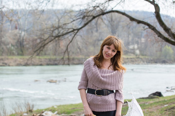 Young cute girl on walk in park