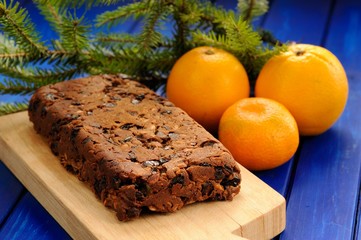 Homemade yummy vegan fruit cake with oranges and clementine deco