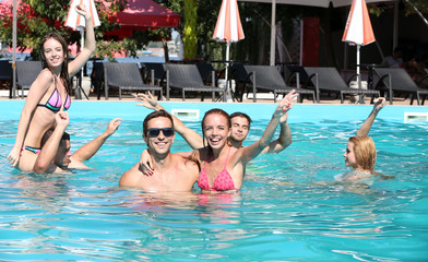 Young people having fun in the swimming pool