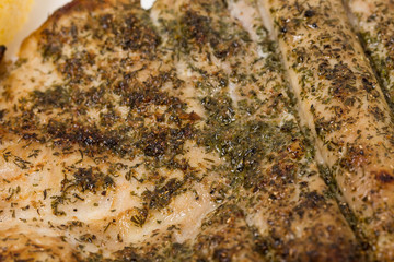 Roasted fish fillet with herbs.