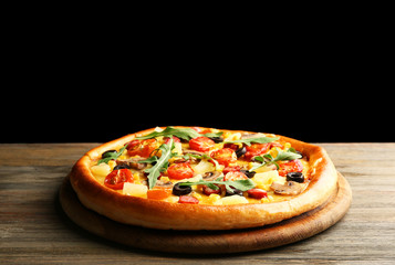 Delicious pizza on black background