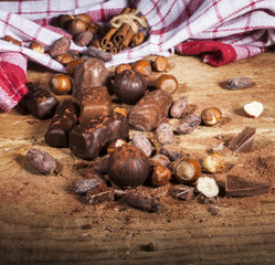Chocolate candies on wooden background