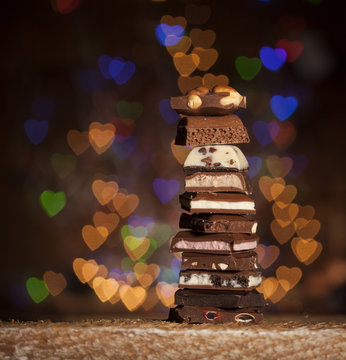 Chocolate stack on colorful bokeh background