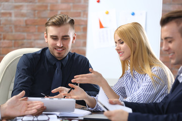 Young business people discussing a new project at the meeting in a conference room