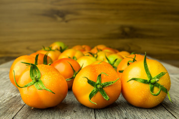 group of tomatoes on wooden background