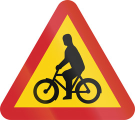 Road sign used in Sweden - Cyclists and moped riders on carriageway