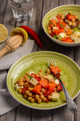Chickpea salad with pumpkin, feta, parsley and chili. Healthy food. Top view.