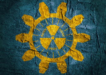 flat gear and nuclear danger icons on concrete textured background
