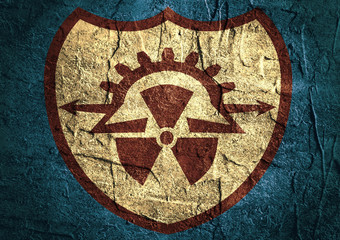 flat shield and nuclear danger icons on concrete textured background