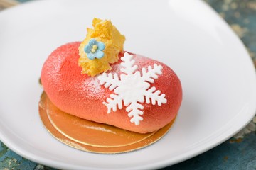 Red pillow desserts in isolated white plate