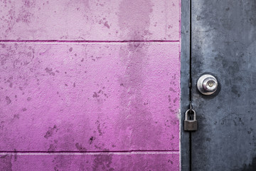 rustic grey metal door with lock on texture stain wal