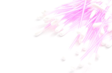 heap of cotton buds on white