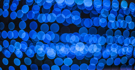 abstract background of blurred blue lights with bokeh effect, ne