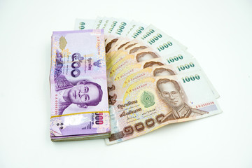 Pile of Thai money on white