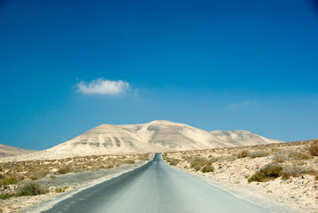 Scenic mountain road with volcano view near Tuineje village, Fuerteventura, Canary Islands, Spain