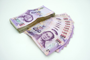 Pile of Thai money on white