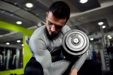 Fototapeta na wymiar Strong powerful male exercise biceps