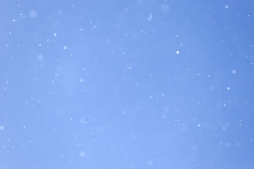 Snow in blue sky