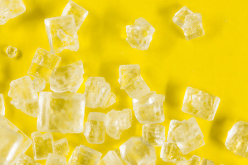 Sugar on a yellow background. super macro