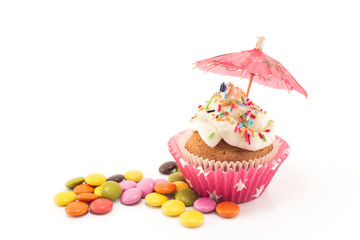Cupcake decorated with paper umbrella