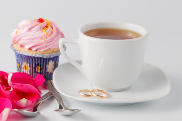 Morning details with rose petals and wedding rings