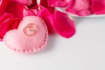 Rose petals and wedding rings