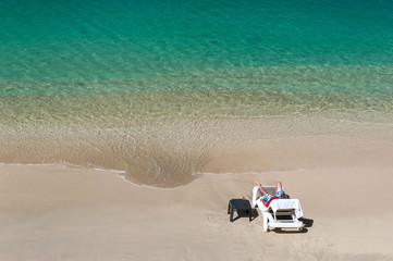 Fototapeta na wymiar Man is relaxing in a Caribbean beach