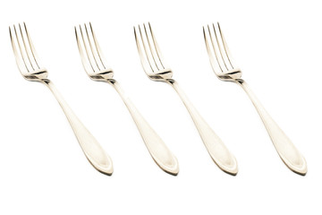 A set of chrome fork for eating on a white background
