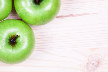 Green apples on the wood