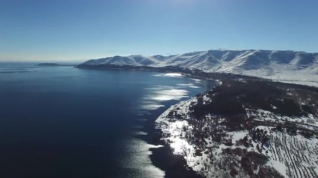 Landscape of snowy  lake Sevan in the background in Armenia