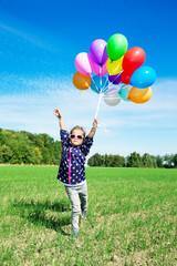 Little girl playing with balloons