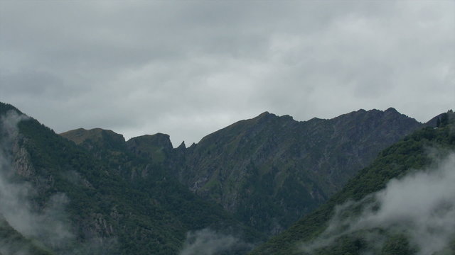 The mountain with fogs in Neuschwanstein Germany. It has white fogs all over the mountain in Germany