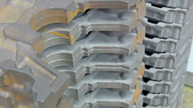 An engine block for machinery in car industry. The term engine block is often used synonymously with cylinder block