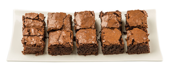 Homemade brownies in white plate over white background