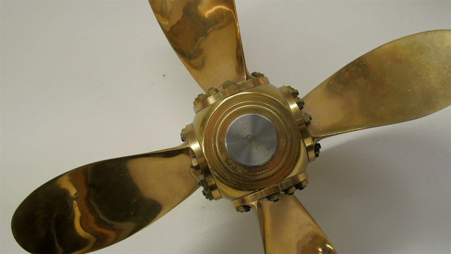 Golden propeller of a boat or ship. The propeller helps in ship navigation