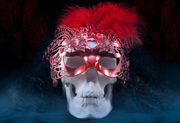Mystical white skull with fur collar and mysterious carnival venetian red mask with feathers.
