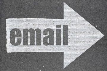 Arrow on asphalt road written word email