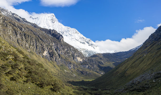 Snow covered mountain peak and blue sky, Cordillera Blanca, Peru
