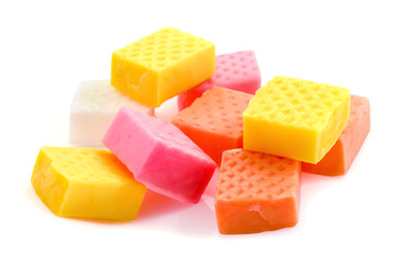 chewing fruit caramel candies close-up isolated on white background
