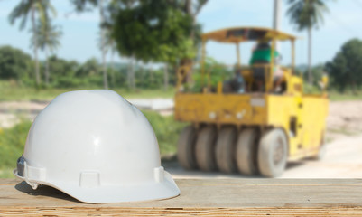 Safety helmet with over Construction site background