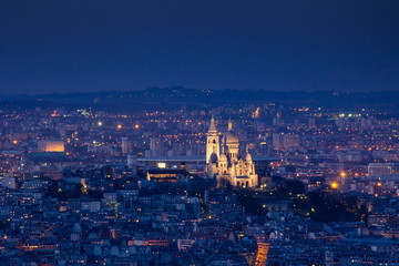 PARIS - 6 AUGUST 2013: Illuminated Eiffel Tower at night and peo