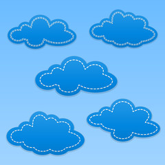 Set of cloud paper tags. Clouds with white dotted lines. Blue colored background