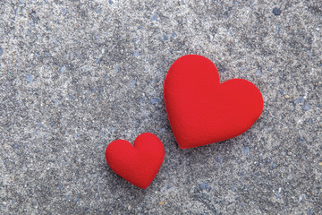 Happy valentine's day background with hearts on concrete floor